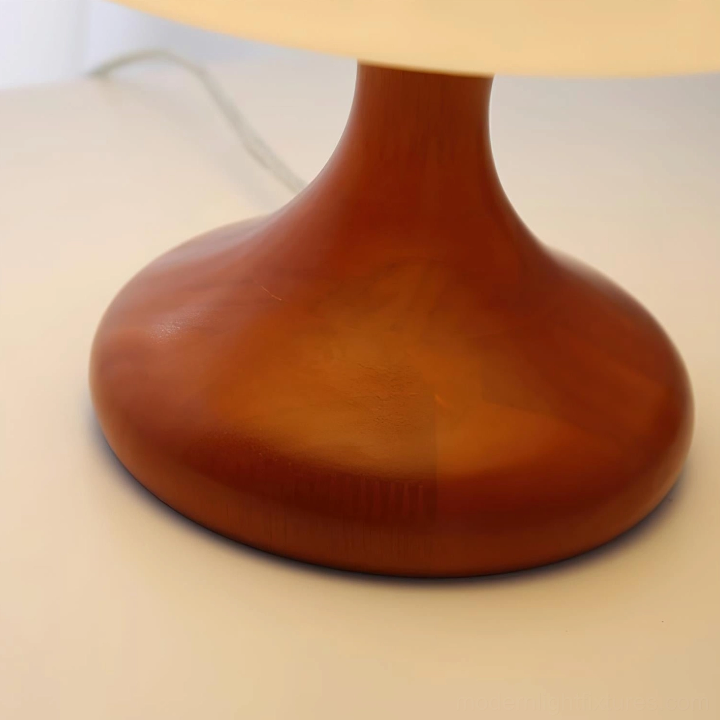 Mushroom table lamp styled in contemporary minimalist home office environment with modern desk accessories and wooden organizational items