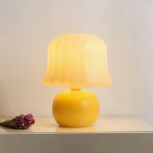 Cream mushroom lamp glowing on bedroom nightstand with warm ambient lighting and dried flower decoration