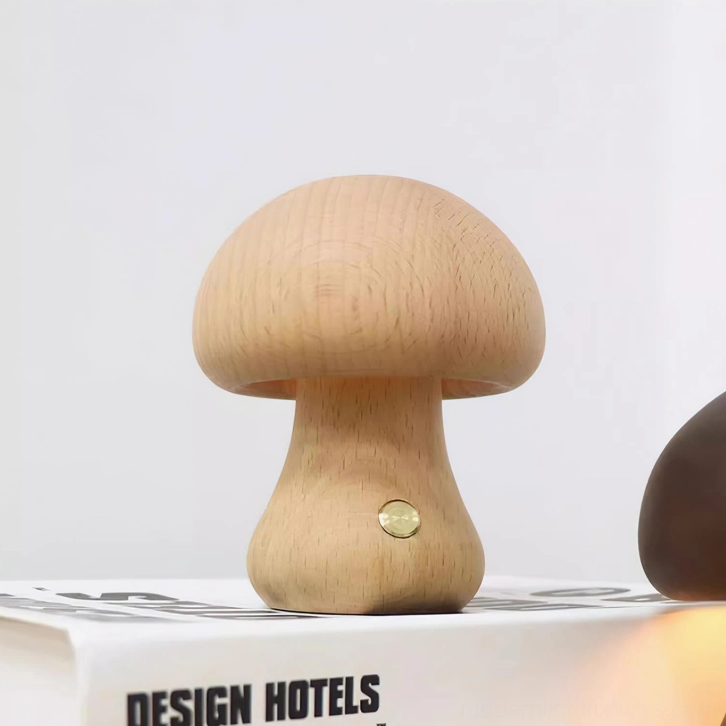 Wooden mushroom table lamp lifestyle shot showing real home setting with Scandinavian design aesthetic