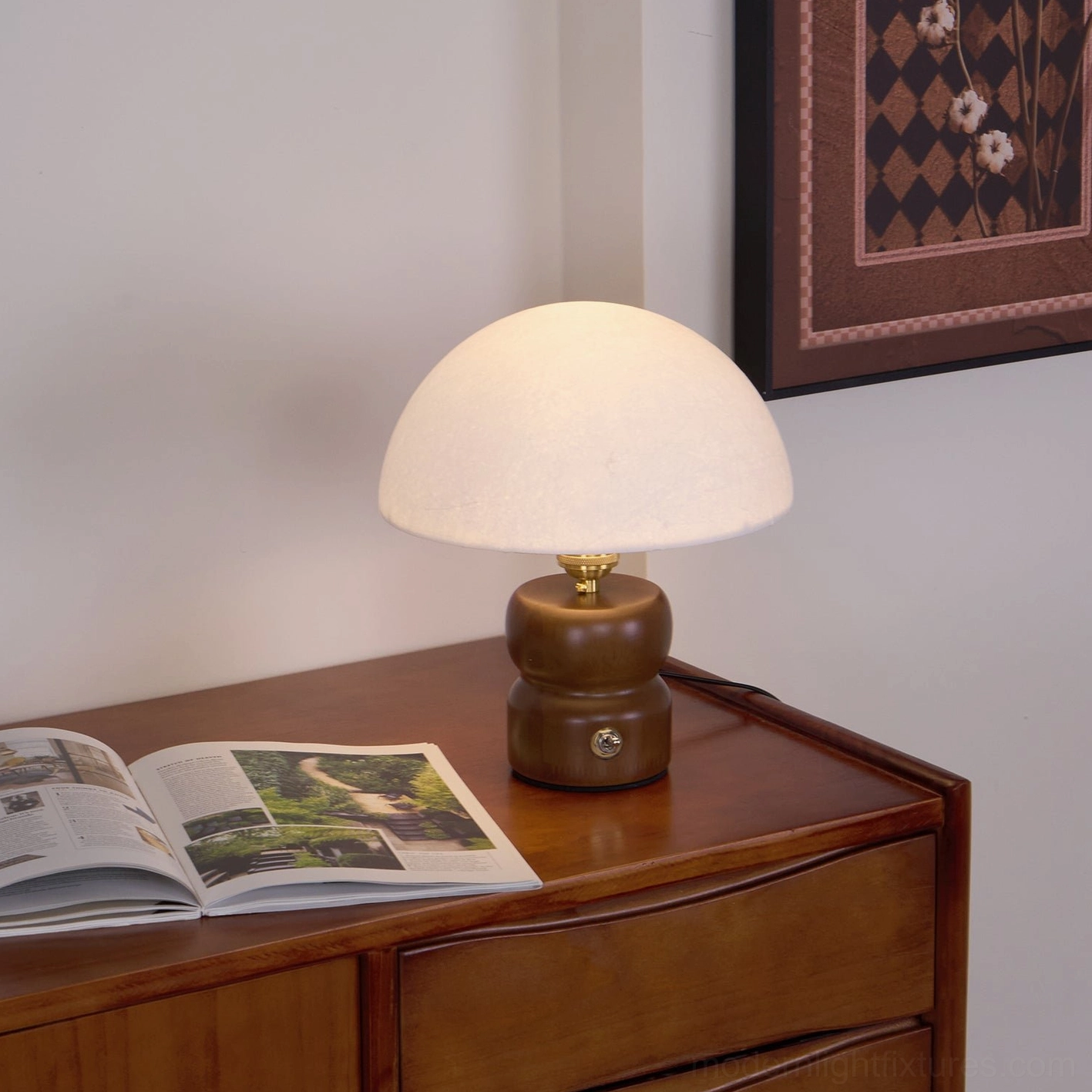Modern table lamp mushroom design creating focused task lighting on home office desk setup