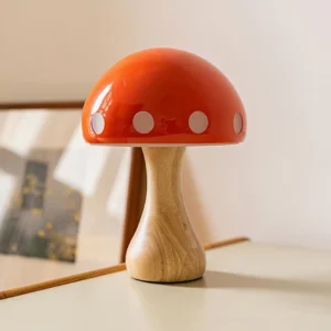Mushroom table lamp three-quarter perspective showing red ceramic shade and wood grain base details