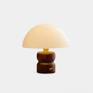 Minimalist mushroom table lamp with off-white fabric shade and dark wood base on white background, front view