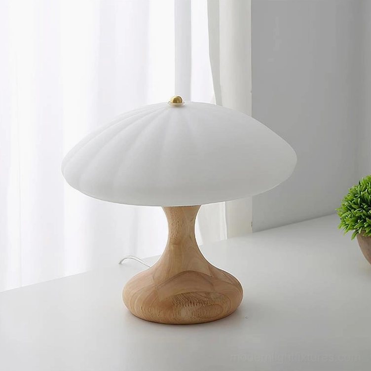Mushroom table lamp with white frosted ribbed shade and light wood base unlit state, potted plant styling home office aesthetic
