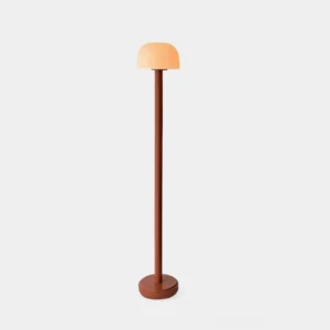 Muto minimalist floor lamp with mushroom dome shade in warm terracotta and white color combination, front view studio product photography