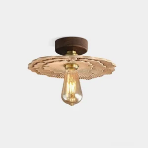 Myco organic carved ceiling light fixture with mushroom-inspired ribbed shade and solid wood base, front three-quarter view against white background