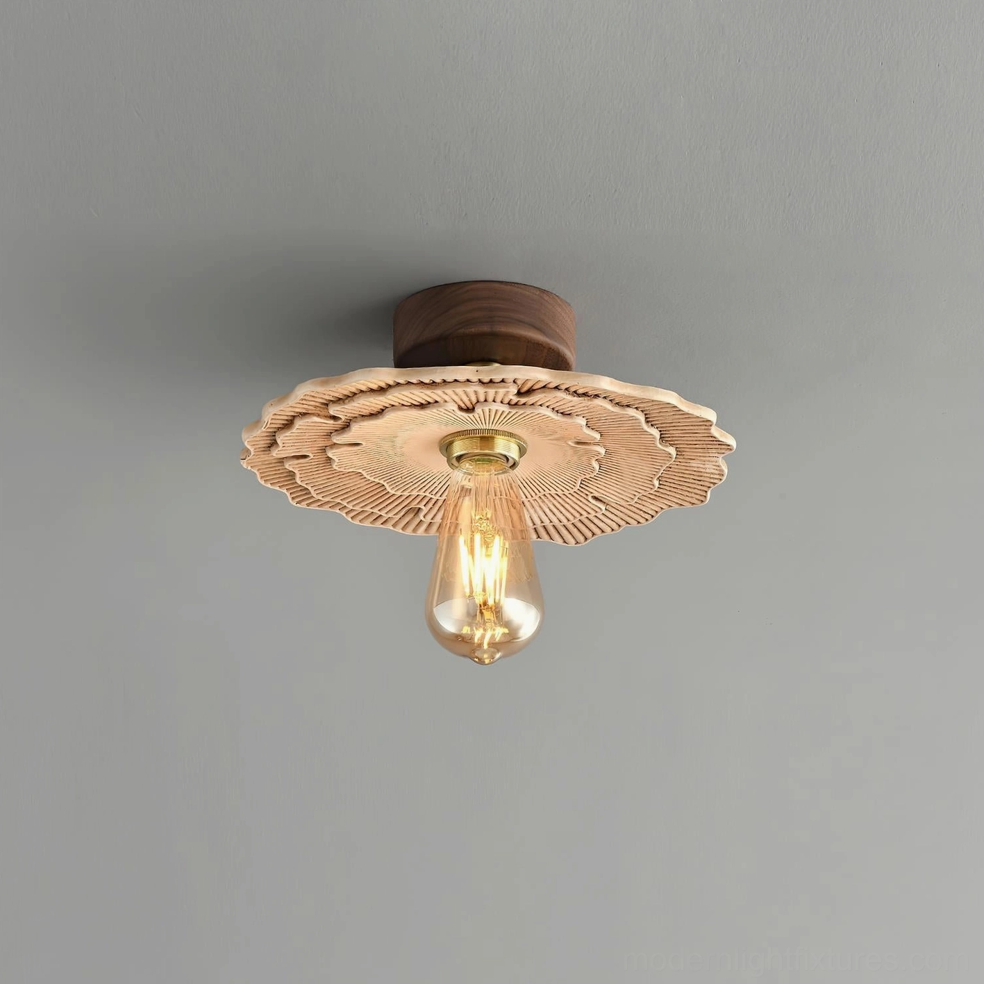 Myco vintage ceiling light with exposed Edison-style bulb, sculptural carved shade front view against gray background