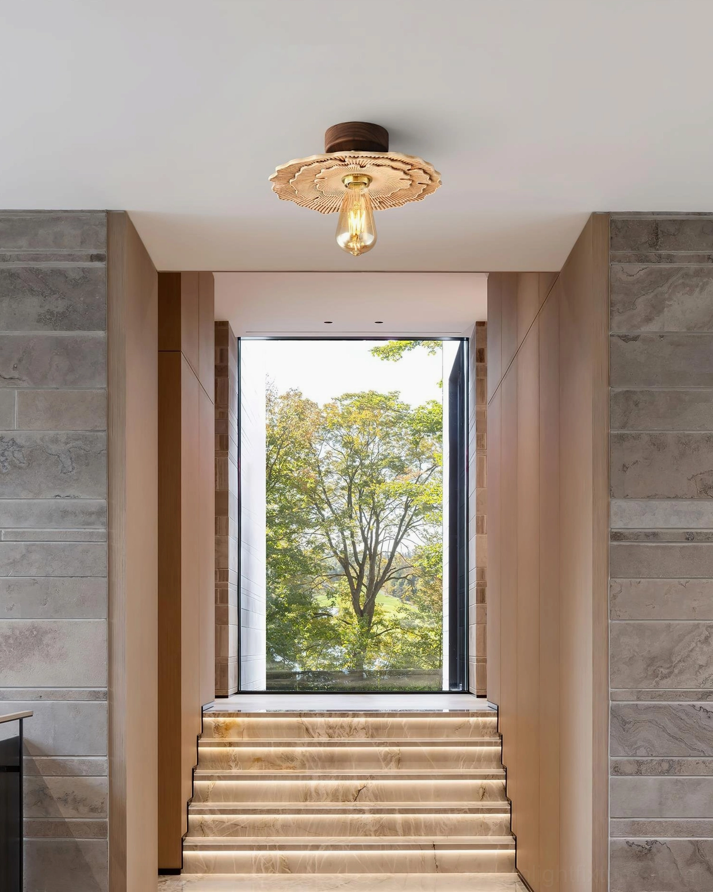 Myco organic ceiling light installed in residential stairwell foyer, warm vintage home interior decor with overhead installation view