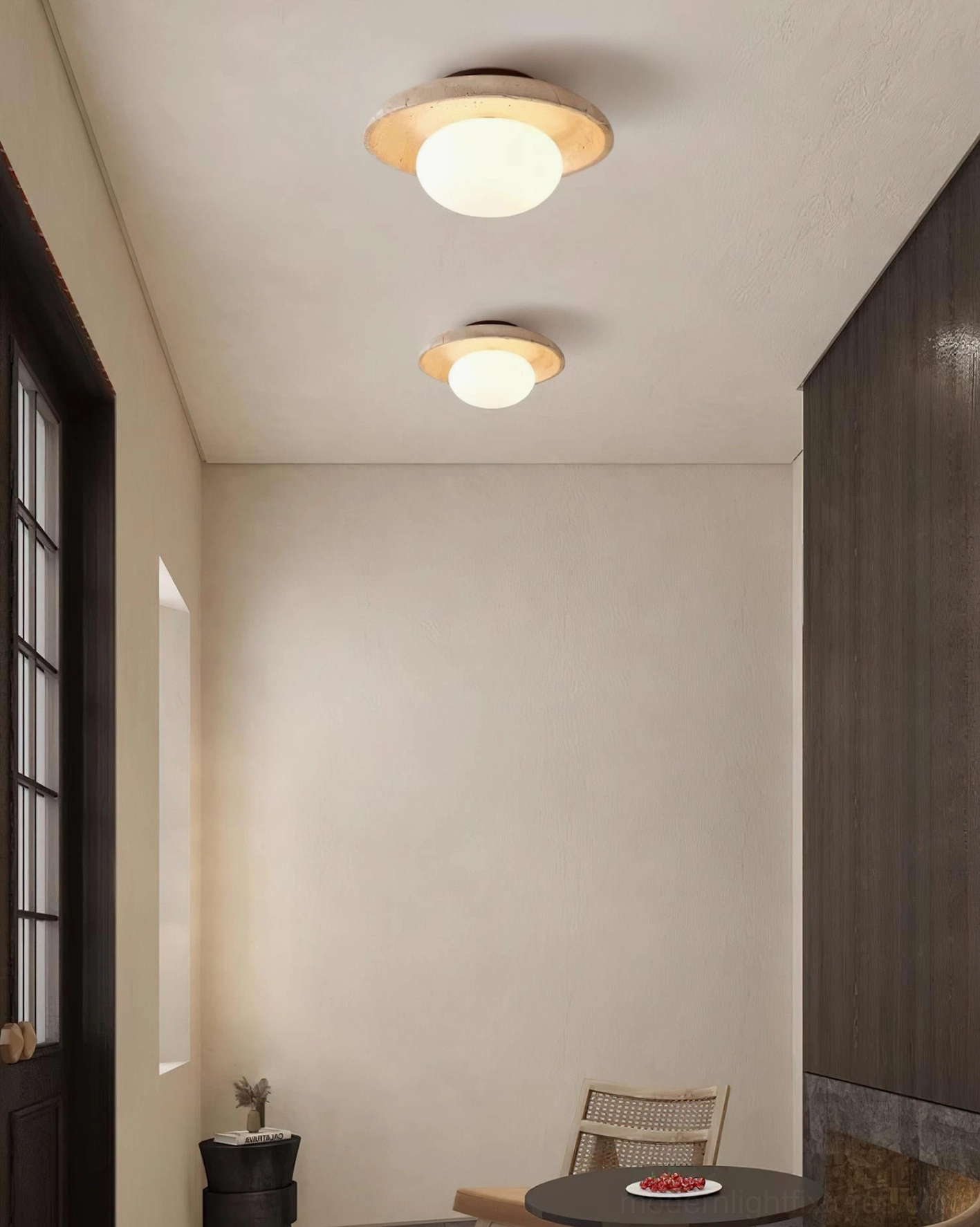 Mylie travertine ceiling light fixture detail showing natural stone surface texture with holes and fissures characteristic