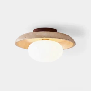 Mylie travertine ceiling light fixture overhead studio view showing frosted glass globe and natural stone frame with warm amber tones