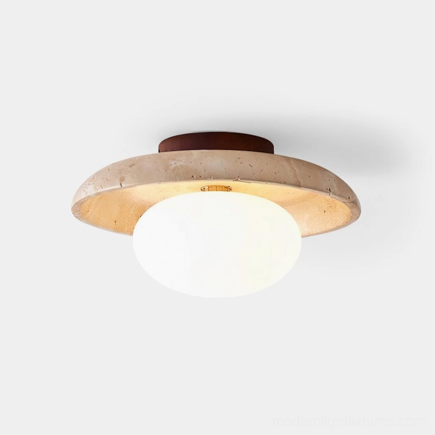 Mylie travertine ceiling light fixture overhead studio view showing frosted glass globe and natural stone frame with warm amber tones