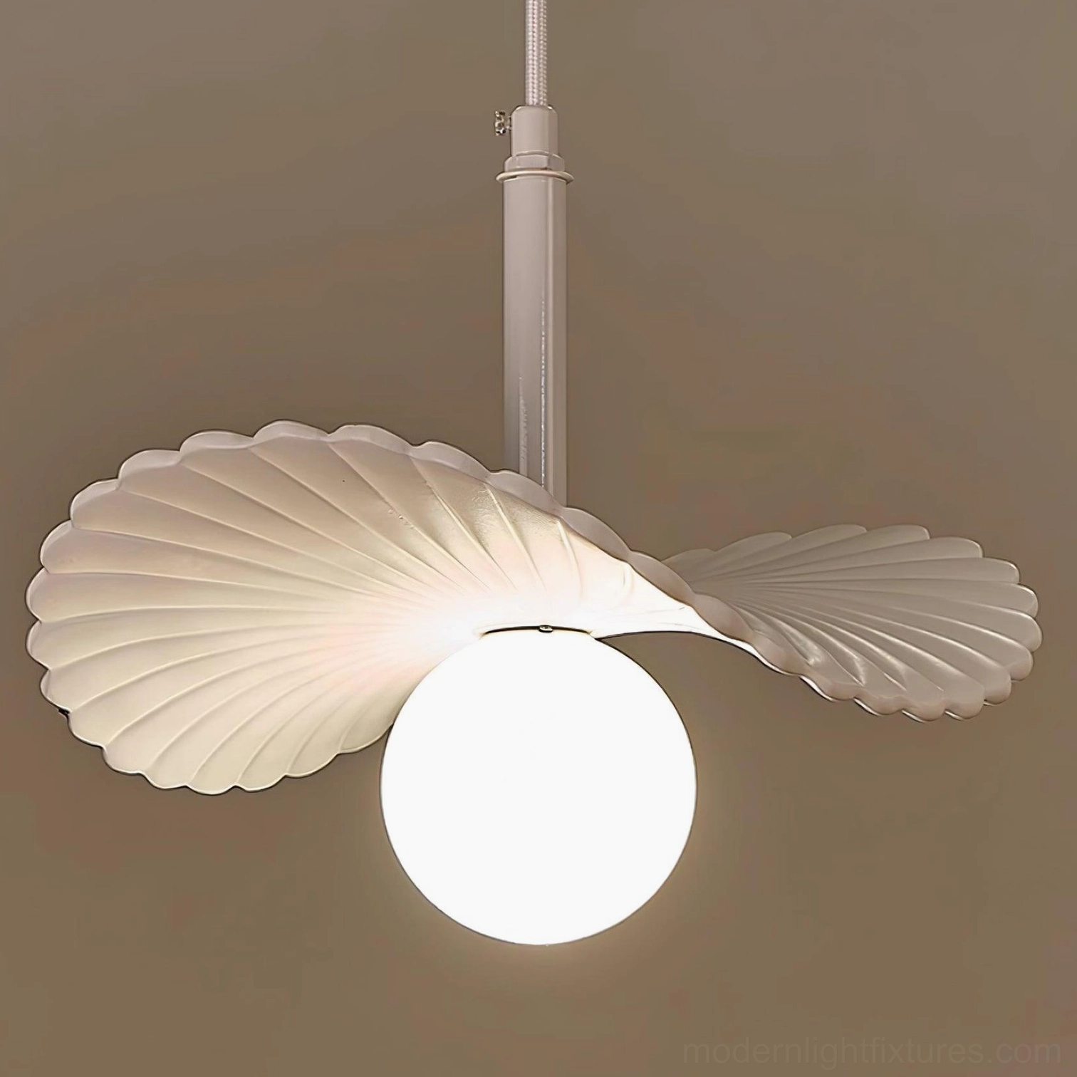 Brown wood-tone Myrna pendant light in contemporary interior setting with minimalist decor and neutral color palette