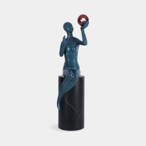 Myron sculpture floor lamp with teal matte seated figure, black marble base, and red spherical lamp head - front view on white background