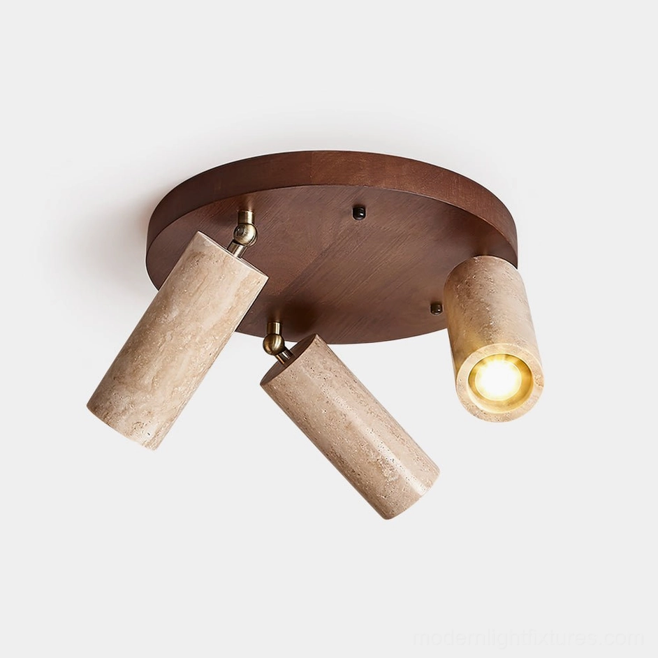 Myrtle 3-head adjustable ceiling light fixture with travertine lamp shades and dark wood canopy, overhead studio view showing brass hardware details