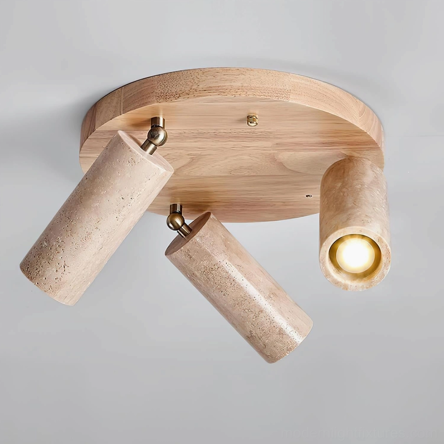 Adjustable travertine cylinder ceiling light with rotatable heads for gallery wall and accent lighting applications