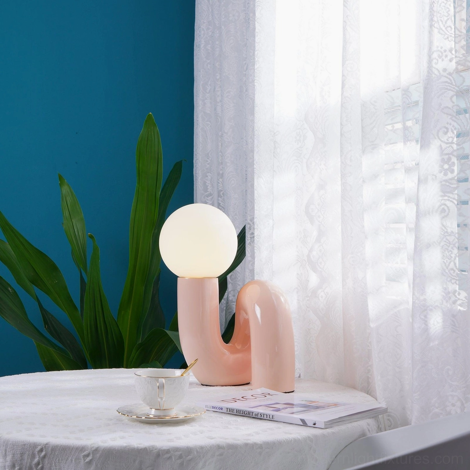 N-shape ceramic table lamp blue variant showcasing cool-tone design sophistication