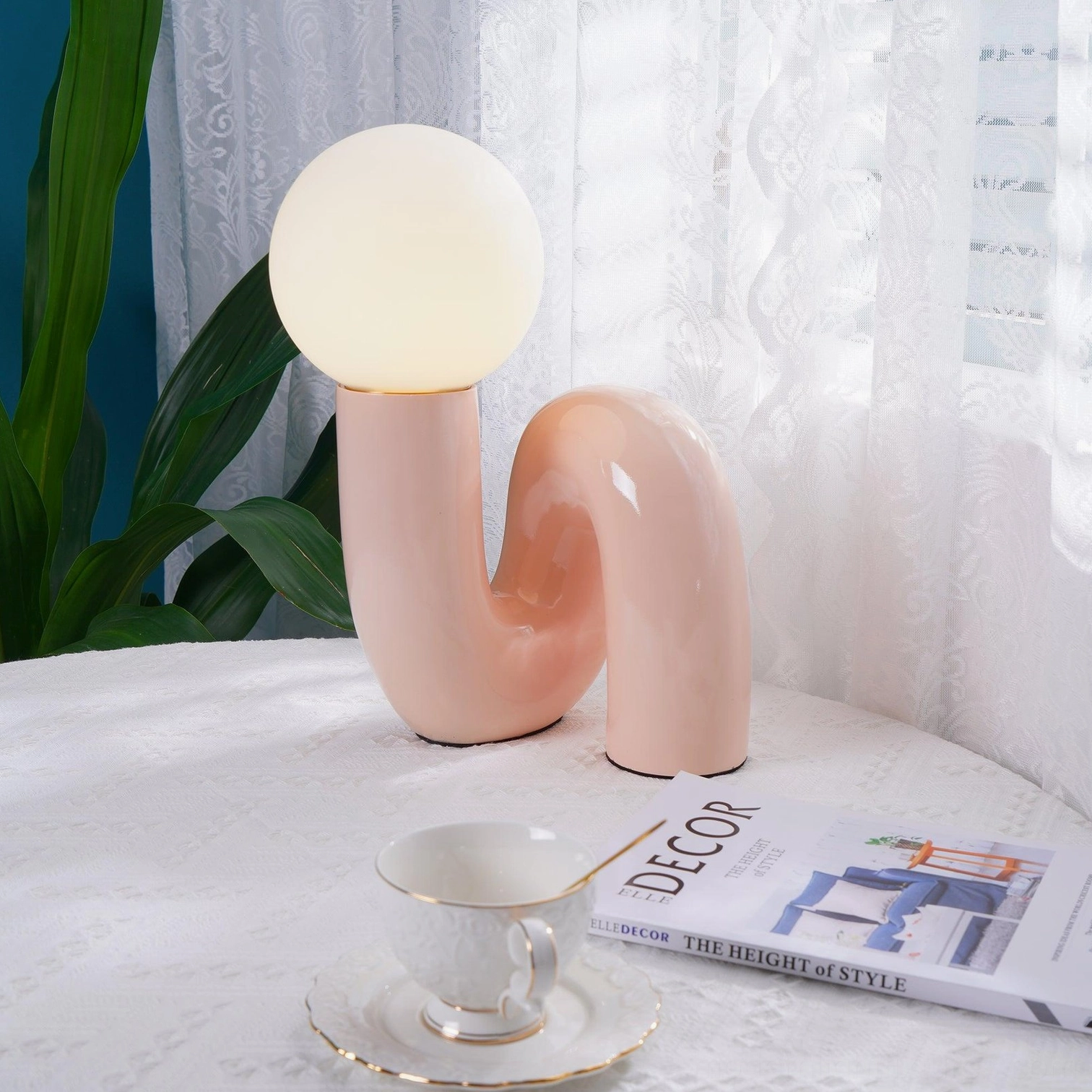 N-shape table lamp blue color option creating calming ambient light in contemporary interior