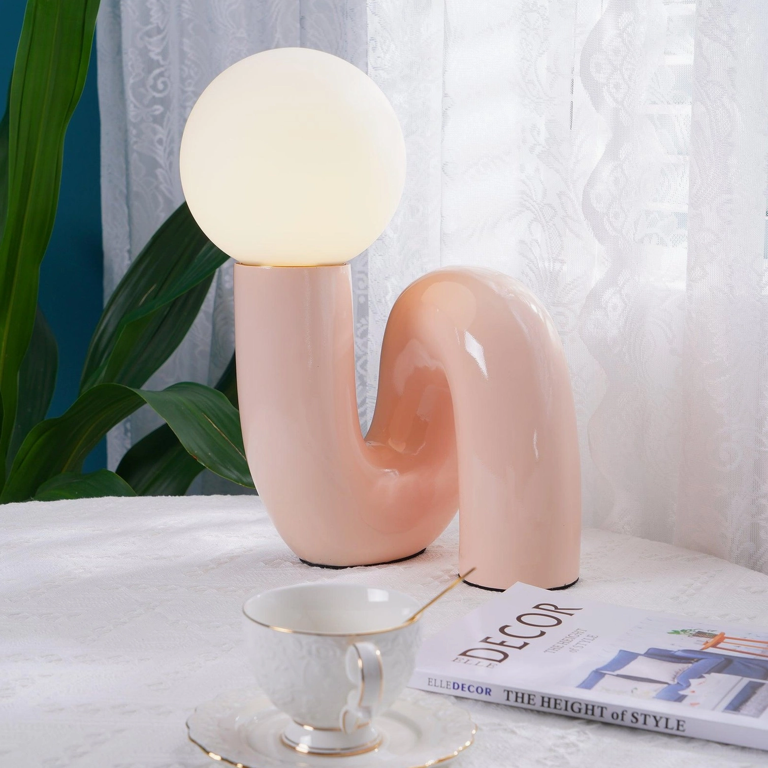 N-shape sculptural table lamp dark red ceramic base with organic curved form detail