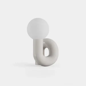 Modern N-shape glass table lamp with curved grey ceramic base and frosted white glass shade, front studio view