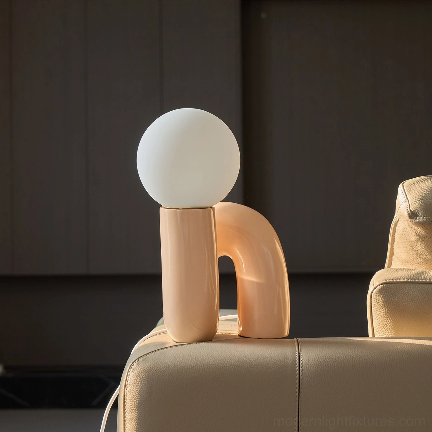 N-shape contemporary table lamp showing 26cm diameter base size specification in scale