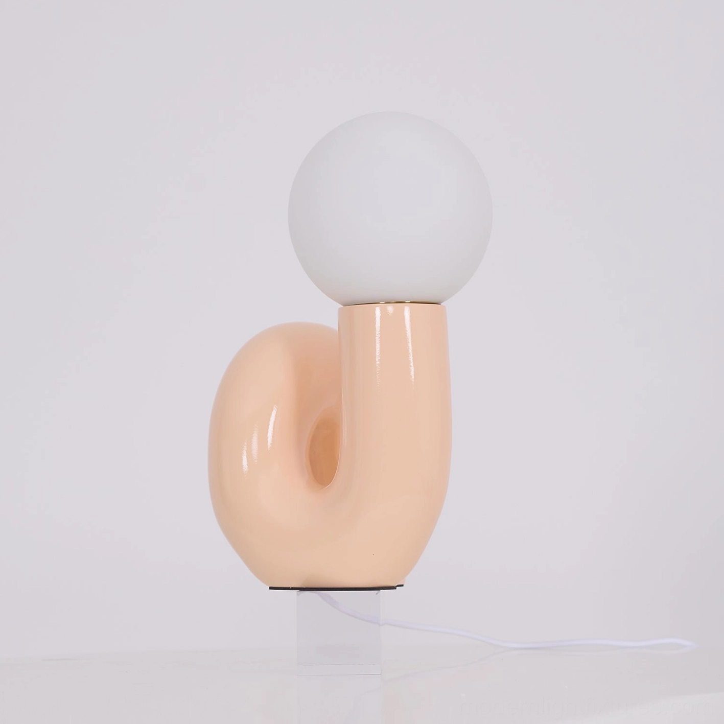 N-shape modern glass table lamp paired with contemporary furniture and accessories lifestyle