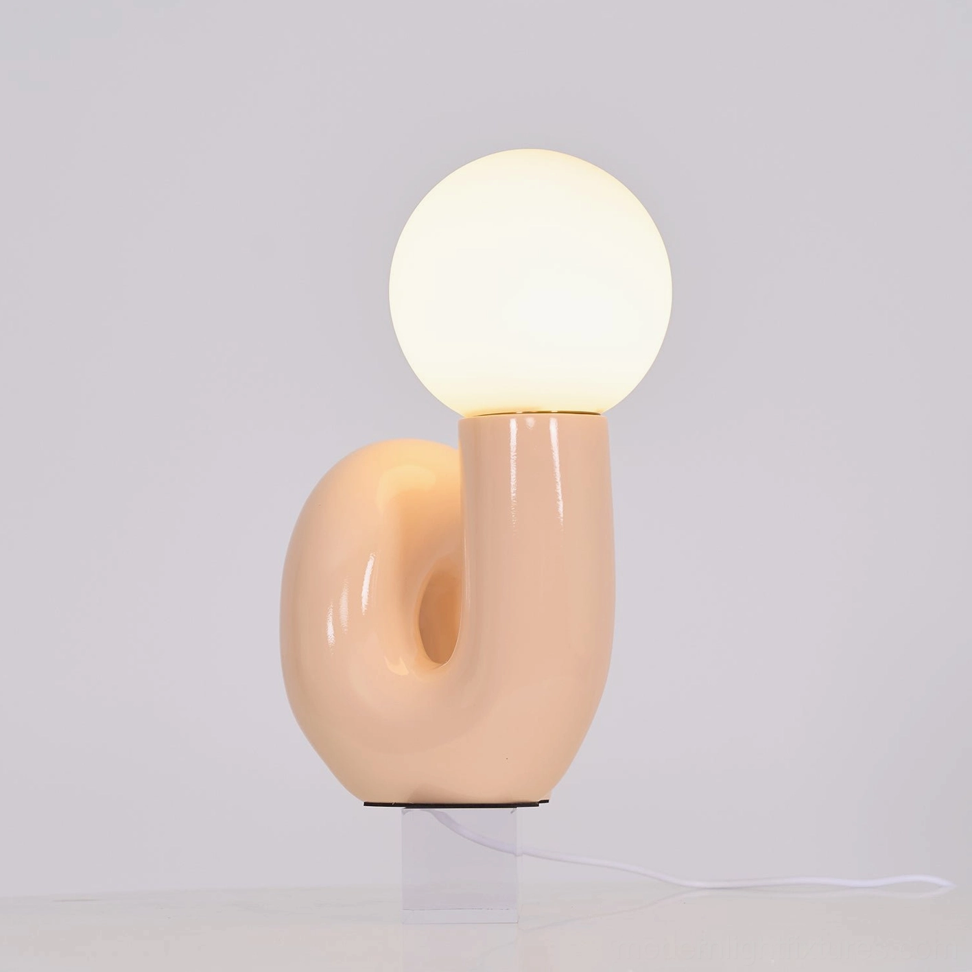 Contemporary N-shape table lamp in eclectic bohemian interior decor arrangement display