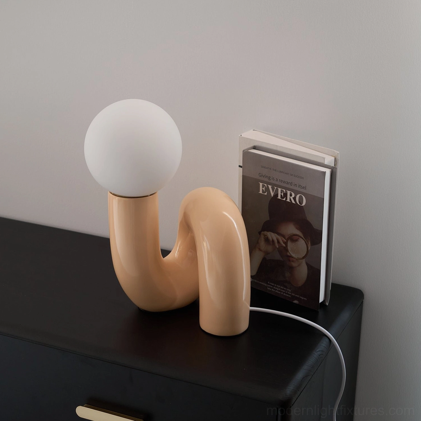Modern N-shape table lamp with frosted resin glass shade showing diffusion capability