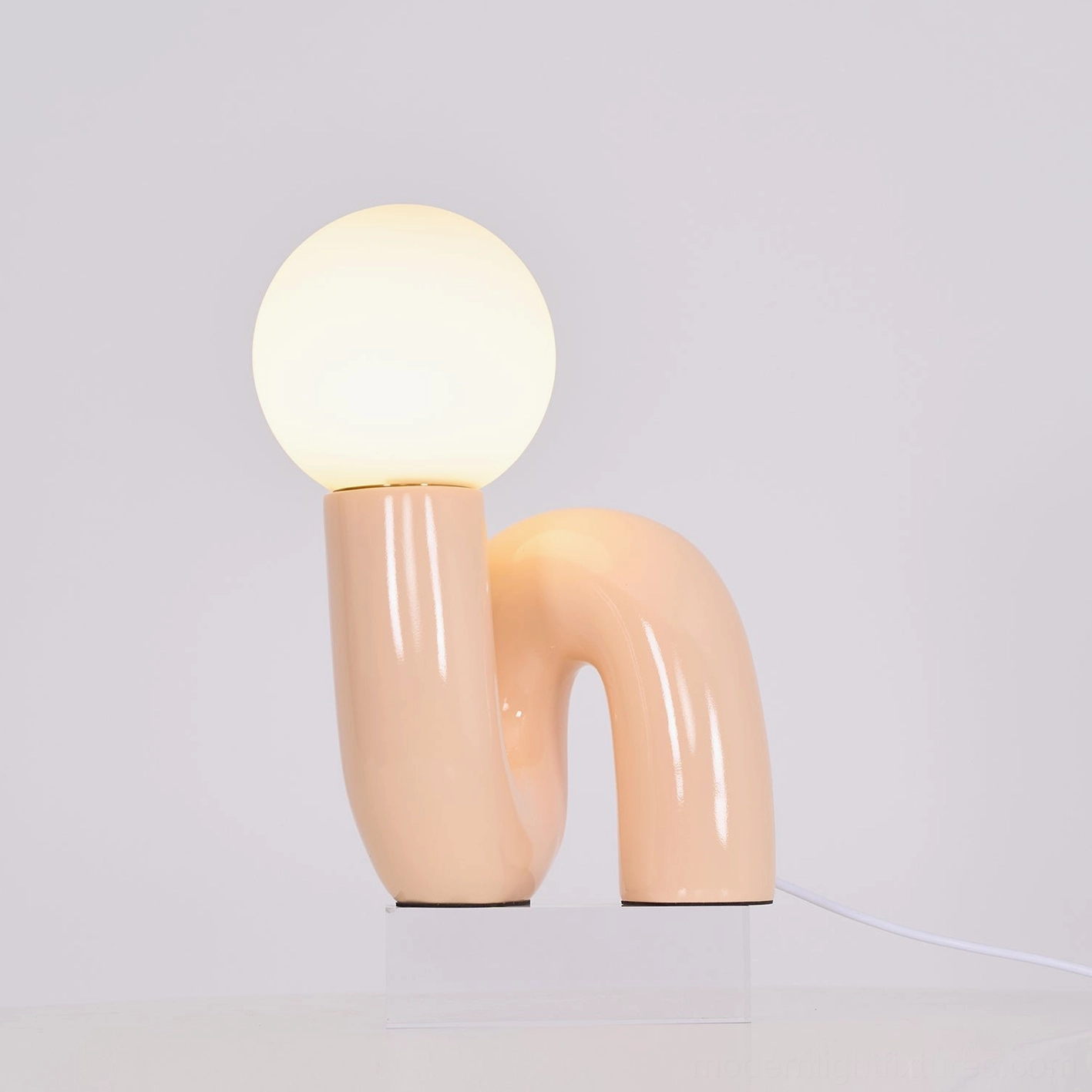Modern N-shape glass lamp in minimalist Scandinavian style home decor environment