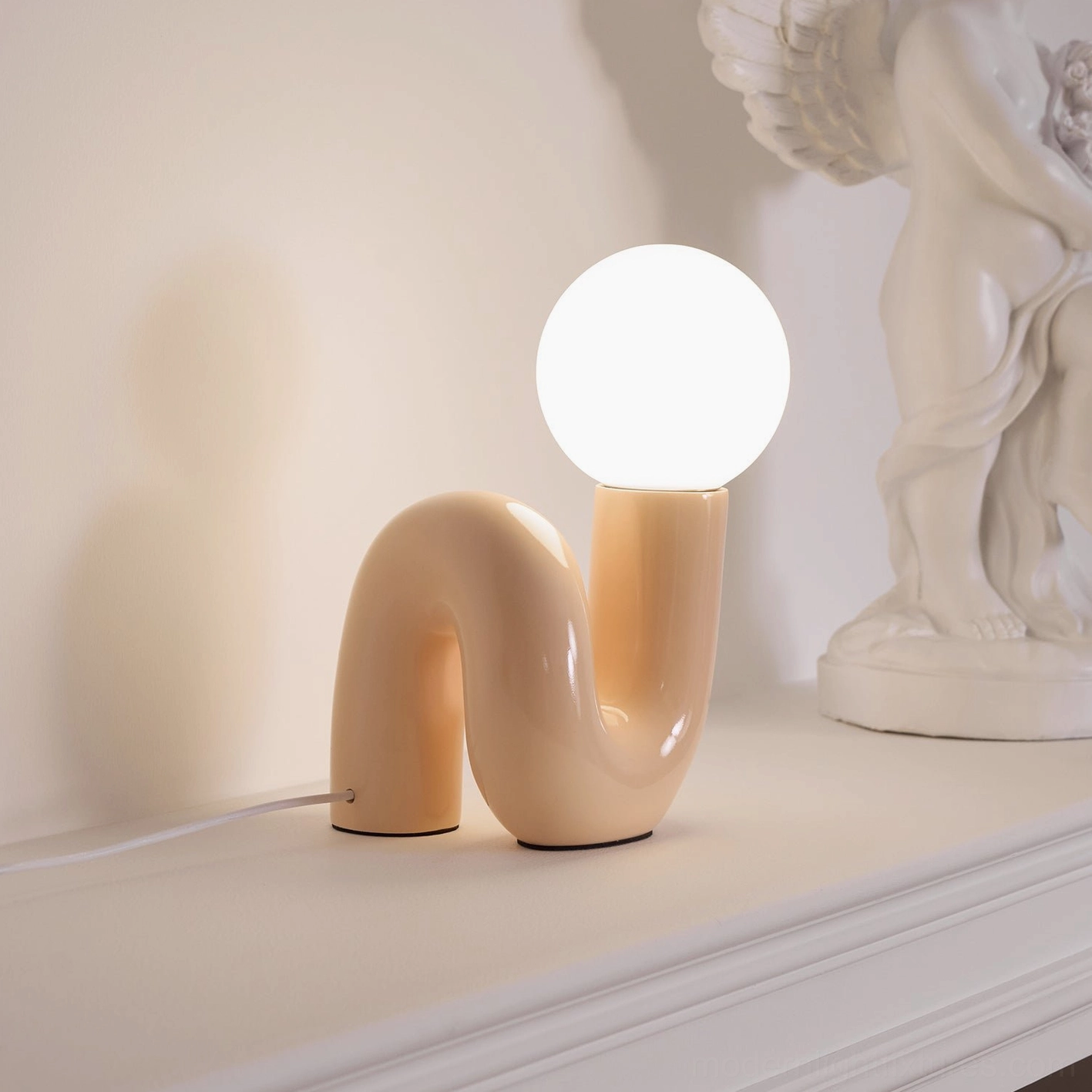Contemporary N-shape table lamp lifestyle photography in elegant home interior setting