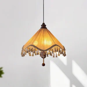 Nadia vintage bohemian pendant lamp in light brown and walnut color, featuring wavy pleated shade with decorative tassels, front overhead angle