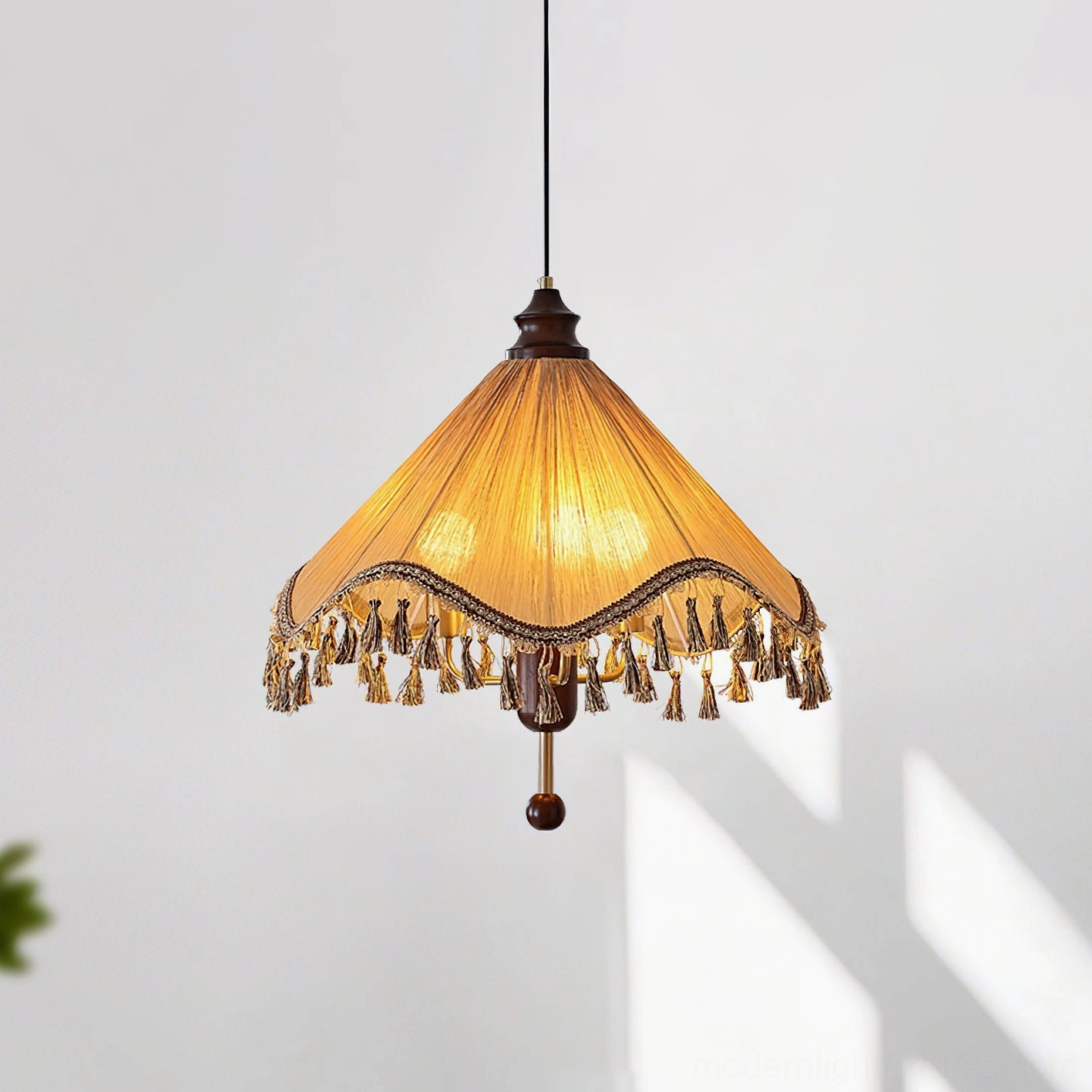 Nadia vintage bohemian pendant lamp in light brown and walnut color, featuring wavy pleated shade with decorative tassels, front overhead angle
