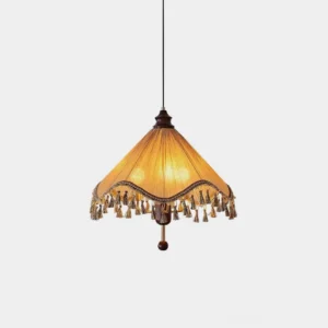 Nadia pleated fabric pendant light with tassel fringe in khaki beige, shown from overhead view against minimalist white studio background