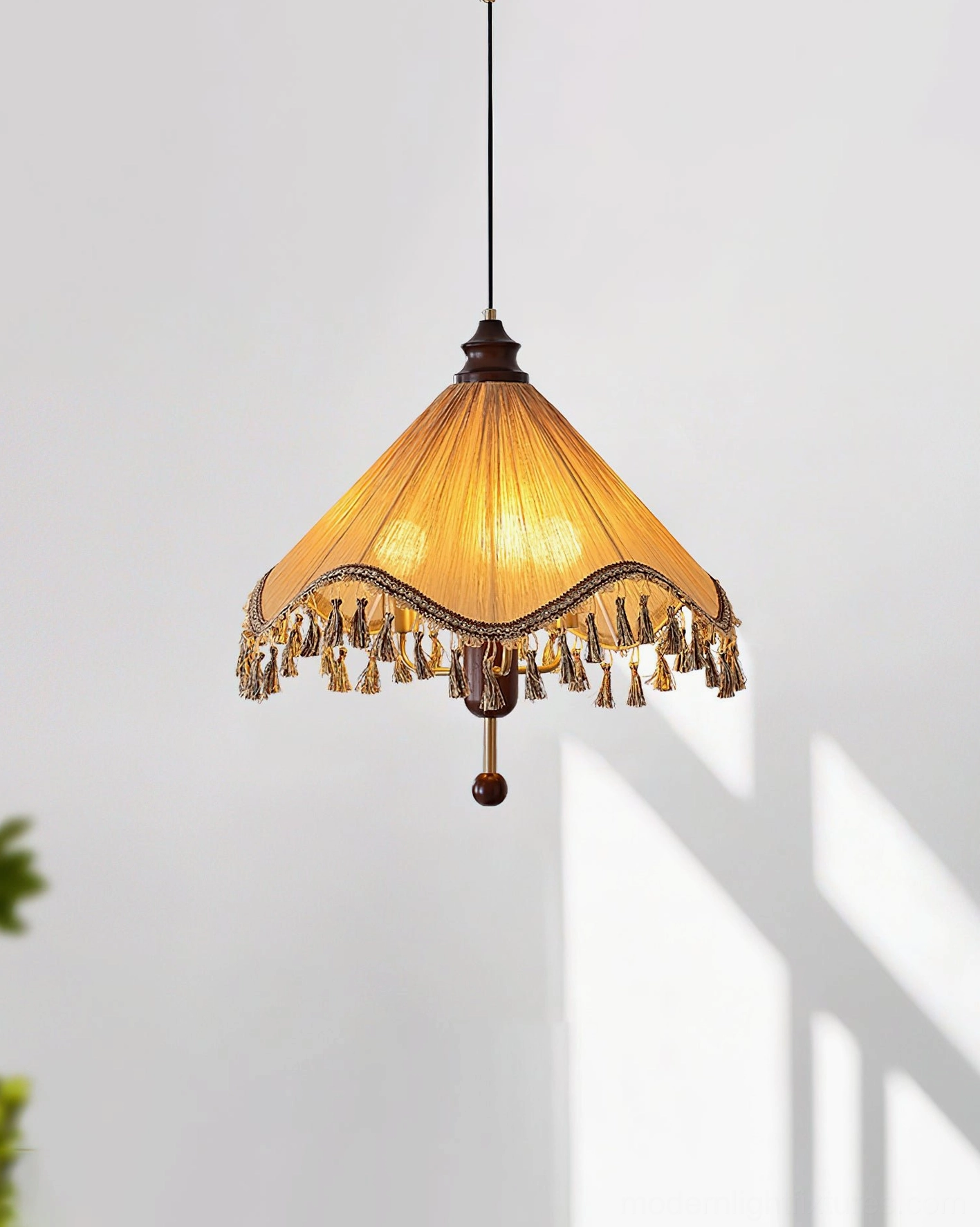 Nadia tassel pendant lamp with khaki pleated shade and dark wood finial, studio overhead view matching main product display