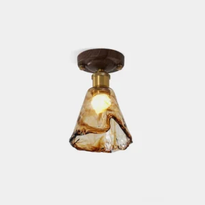 Nalia amber glass flush mount ceiling light - front close-up view showing molten texture glass shade with walnut wood base and brass hardware on white background