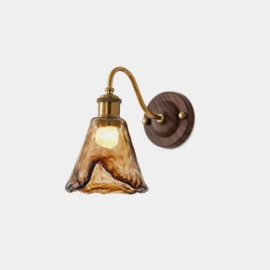 Nalia amber glass wall sconce front view studio shot with brass arm and dark wood backplate against white background