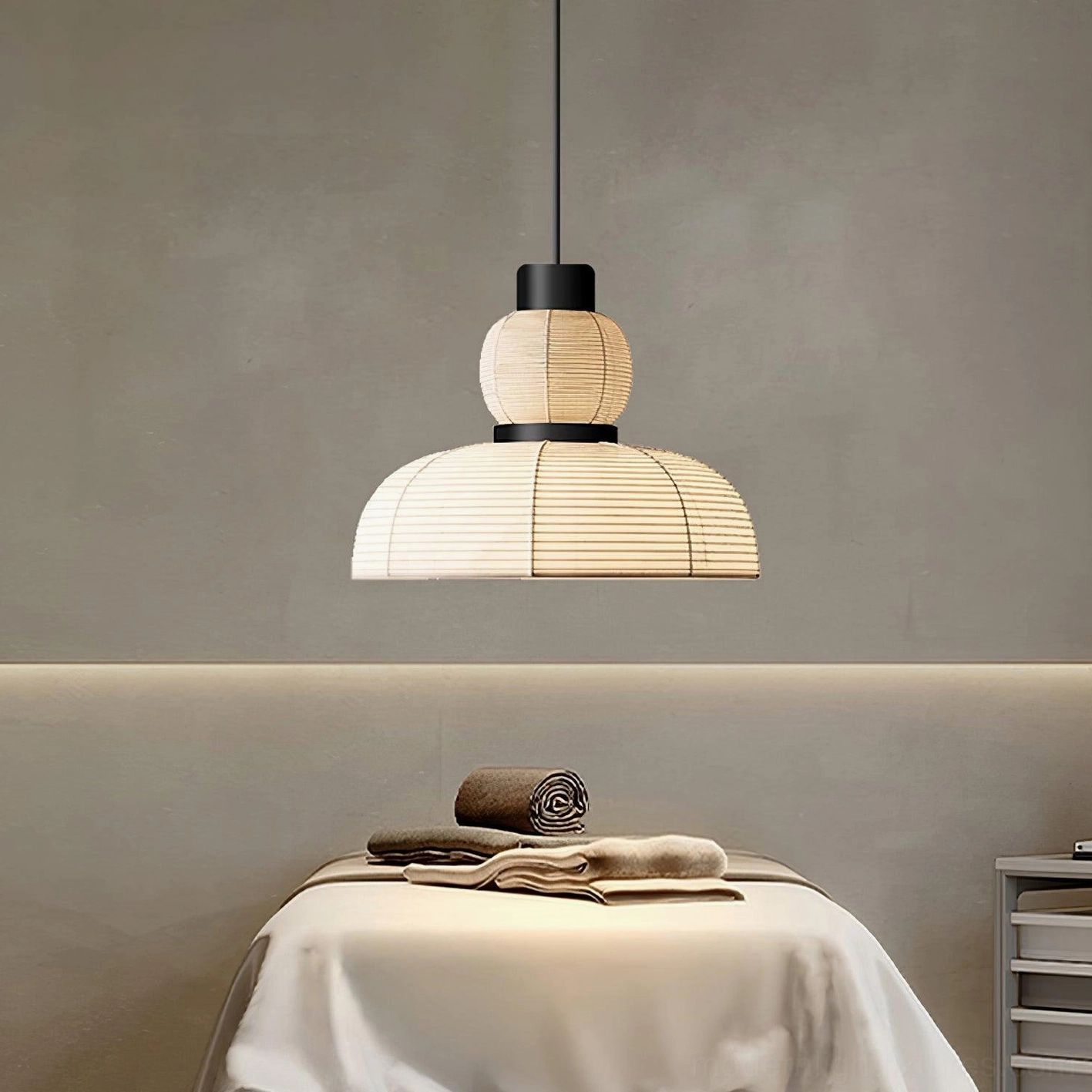 Single Nando modern rattan pendant light in bedroom corner, warm beige woven shade, soft ambient lighting