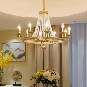 Gold beaded chandelier with crystal drapes installed in luxury modern living room with warm ambient lighting