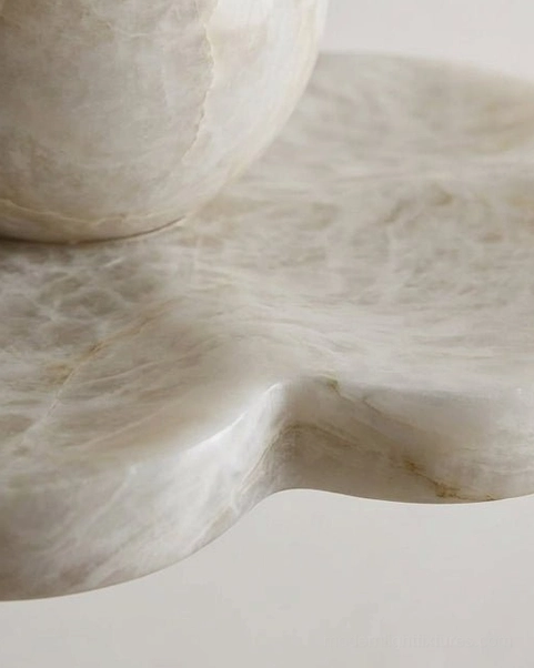 Hand-carved natural alabaster ceiling light with unique veining and translucent stone material for organic modern interior design