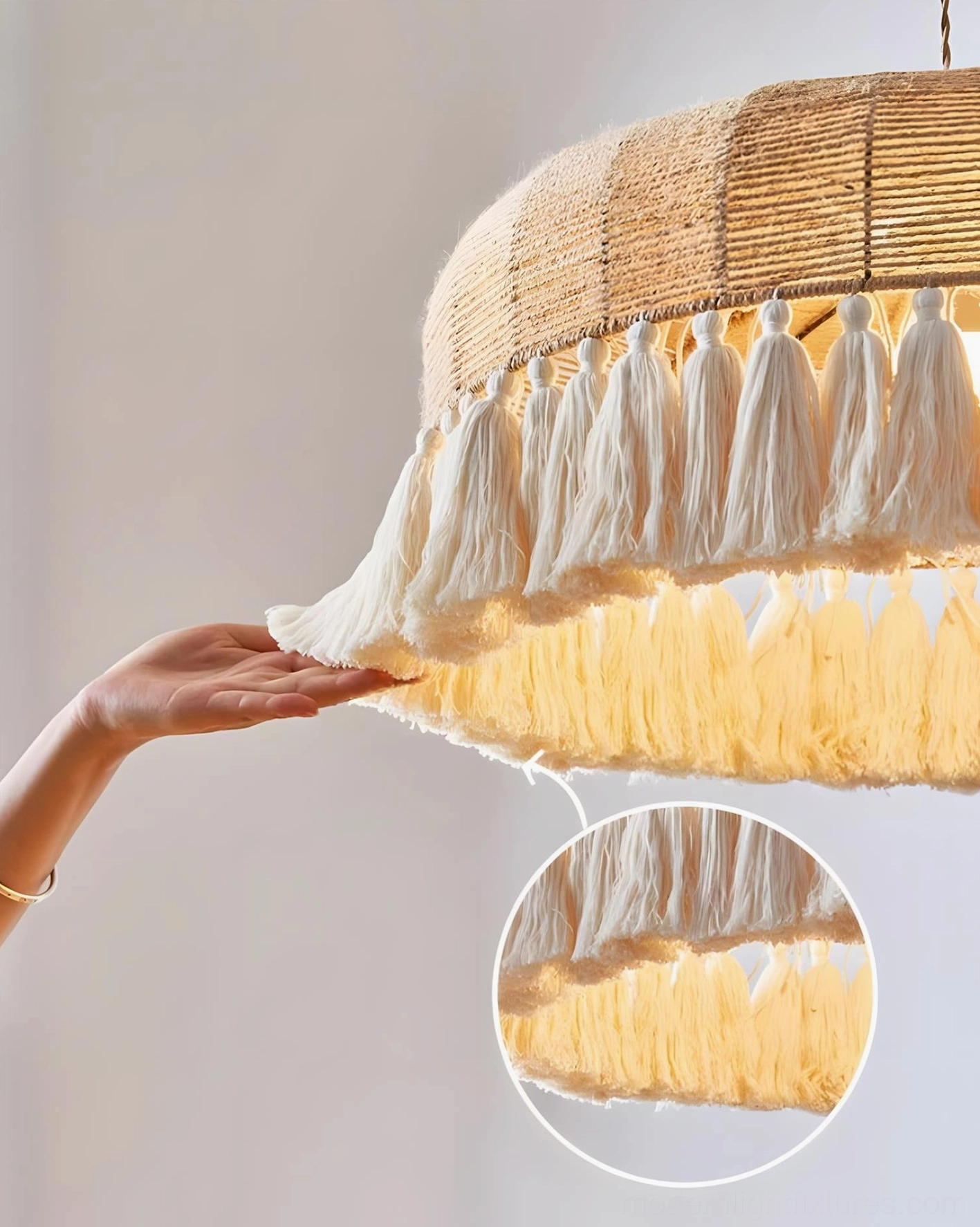 Natural bohemian rattan tassel pendant lamp creating ambient lighting in residential interior space
