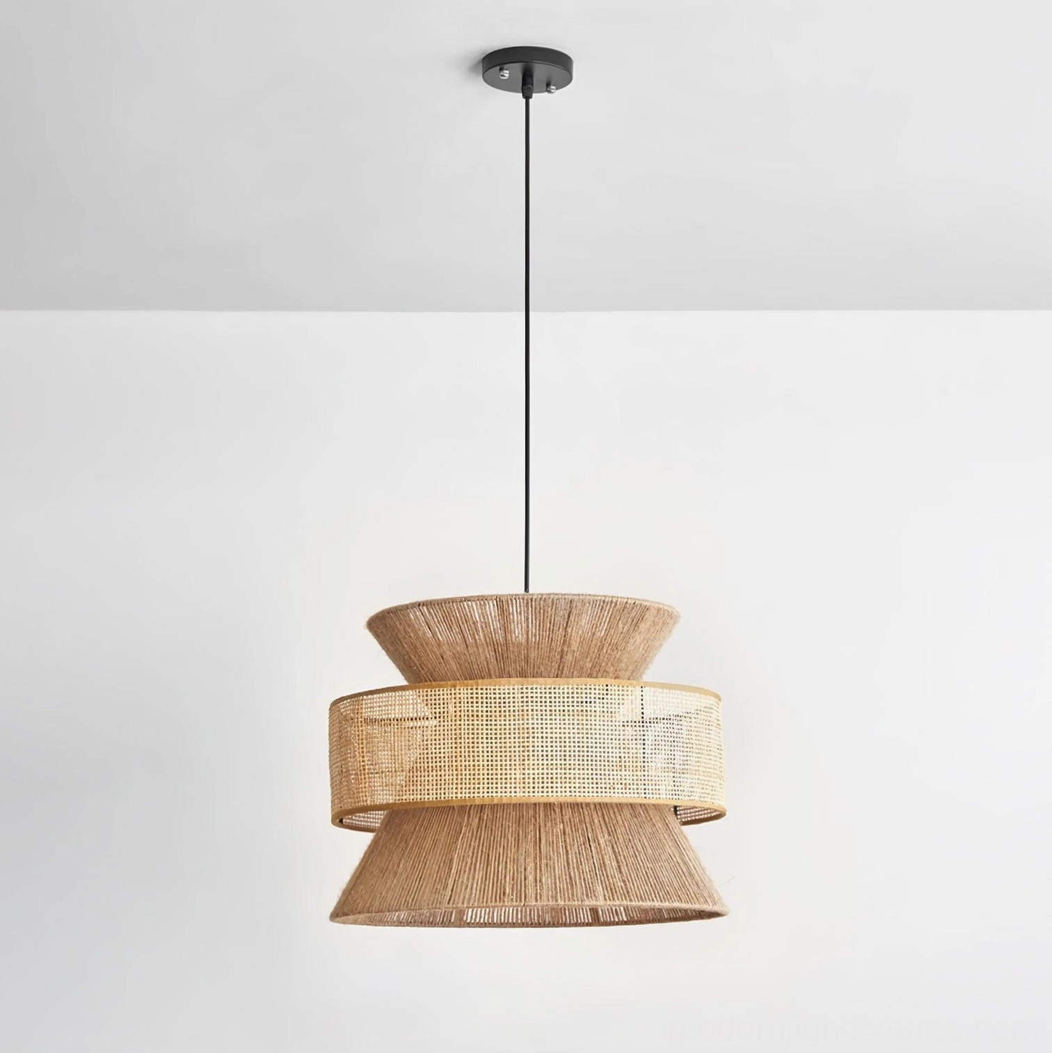 Natural brown woven rattan pendant light with layered silhouette in wabi-sabi style