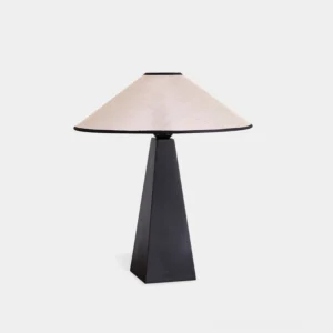 Natural fiber table lamp with tapered black base and off-white plant fiber shade, studio front view
