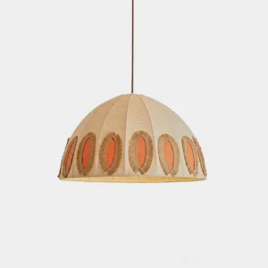 Natural linen dome pendant light with coral orange oval details and raffia fringe rings, front view isolated on white background
