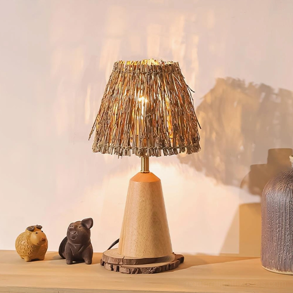 Natural wood bohemian table lamp with woven straw shade displayed on decorative console