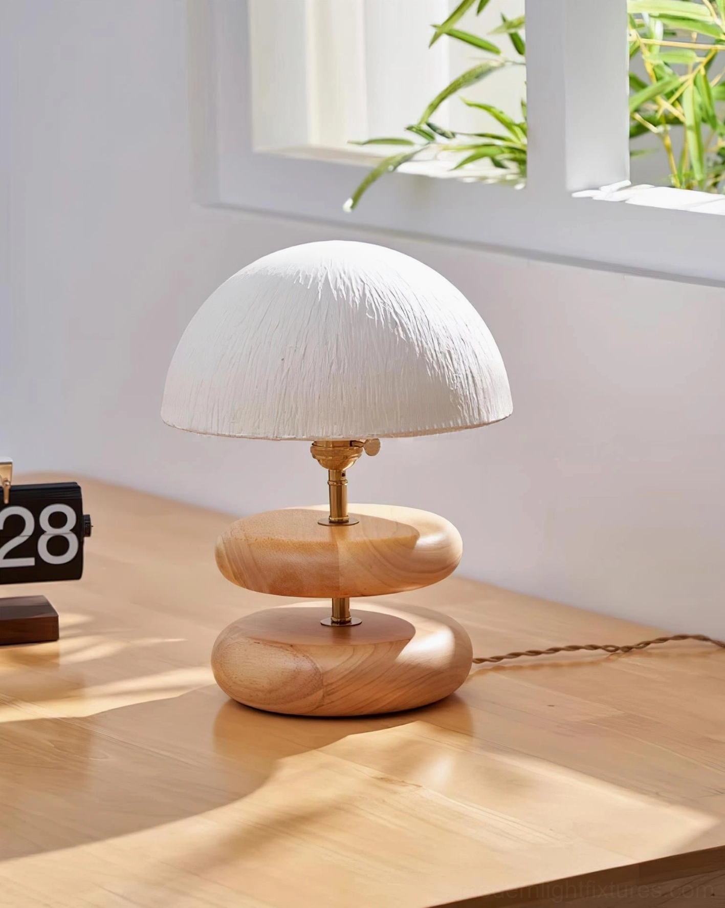 Natural wood stacked ring table lamp beige fabric dome shade front view wooden desk minimalist decor