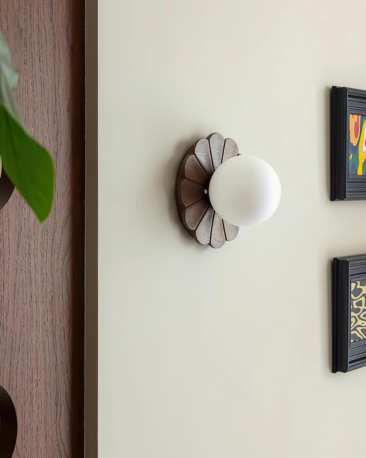 Natural wood petal frame wall sconce in minimalist vintage style on residential interior wall