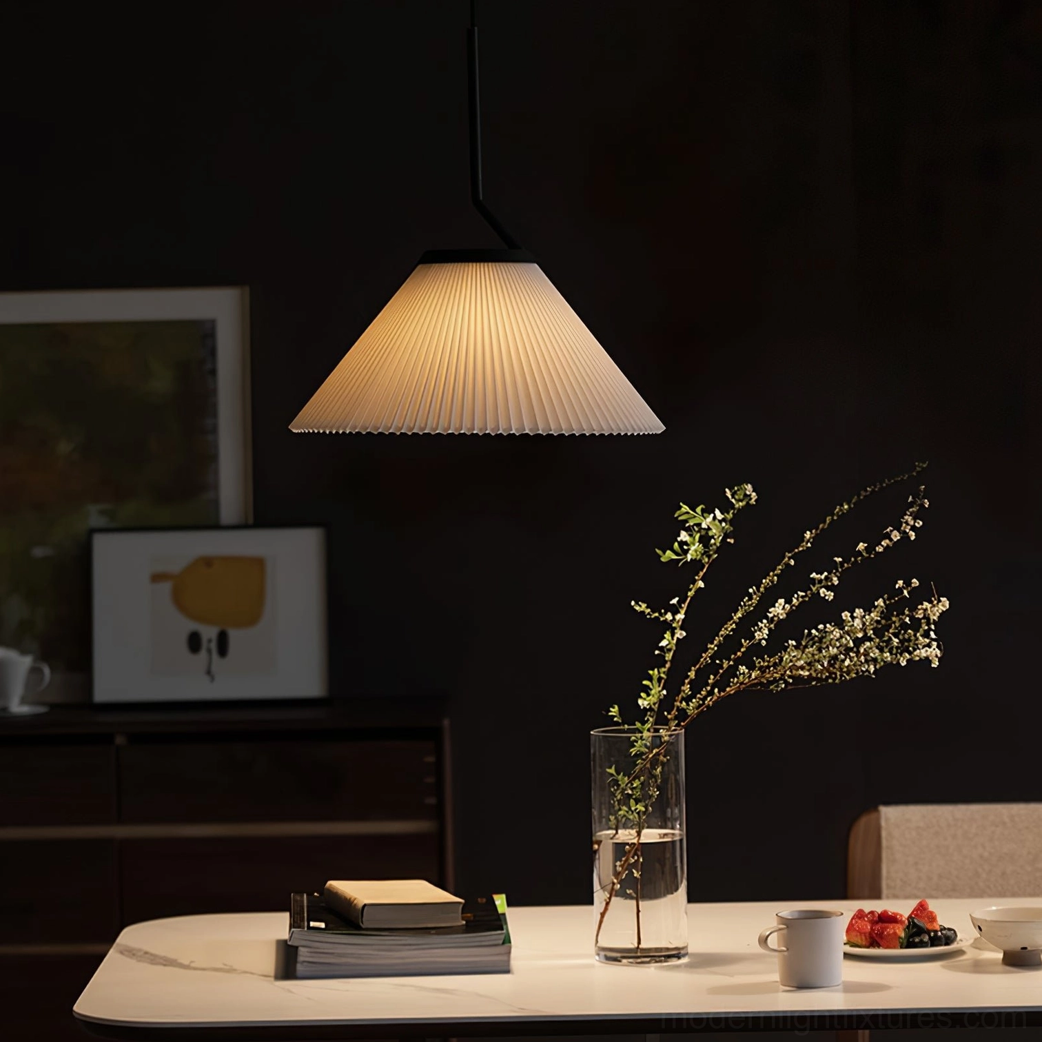 Single Nebra pleated pendant light above dining table - Japandi minimalist style with warm illumination