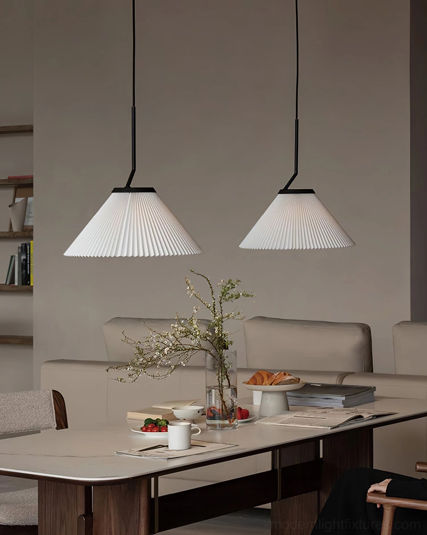 Twin Nebra pleated pendant lights above dining booth - warm japandi home style interior