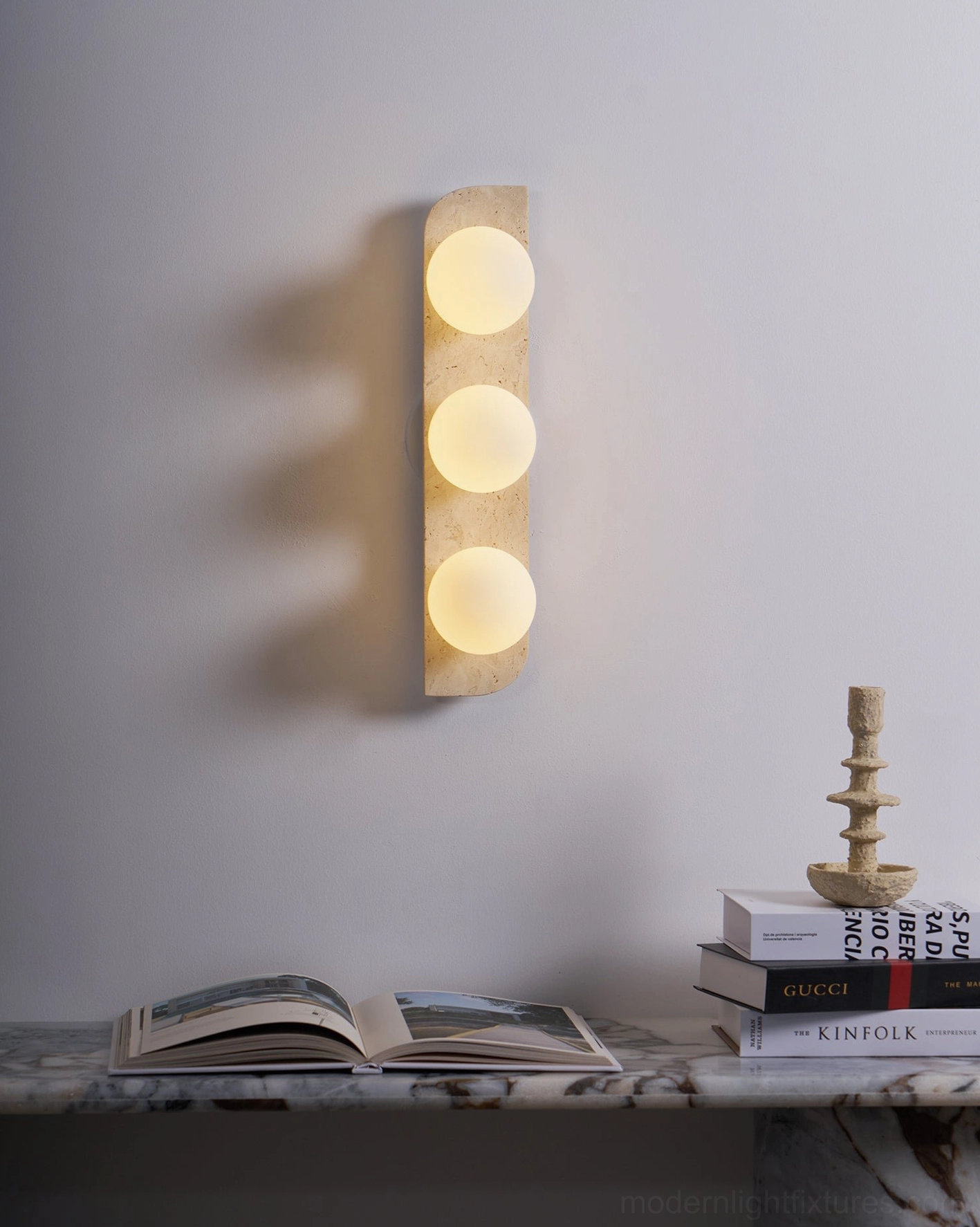 Neptune travertine wall sconce installation guide showing mounting height and wall placement specifications