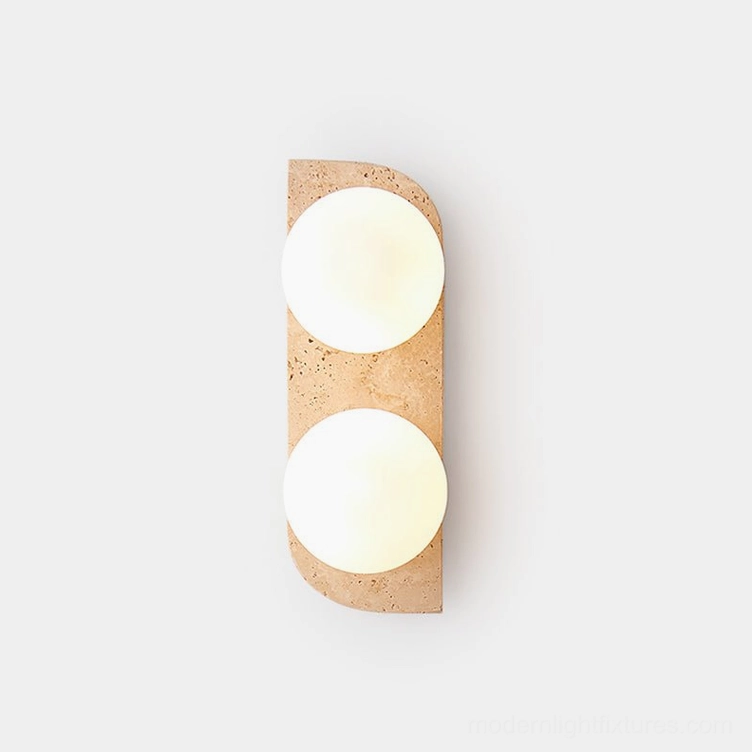 Neptune travertine wall sconce with two light fixtures mounted vertically on white wall