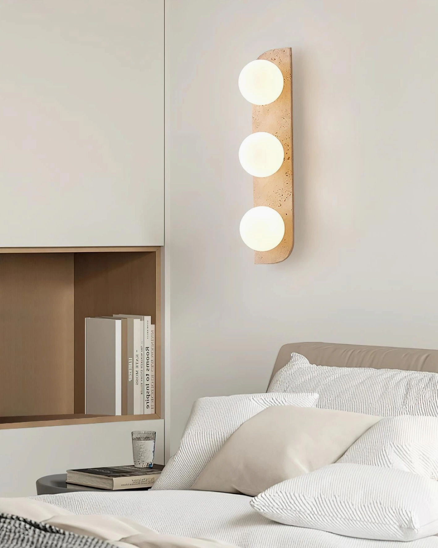 Neptune walnut travertine wall sconce pair installation showing complementary color matching in home interior