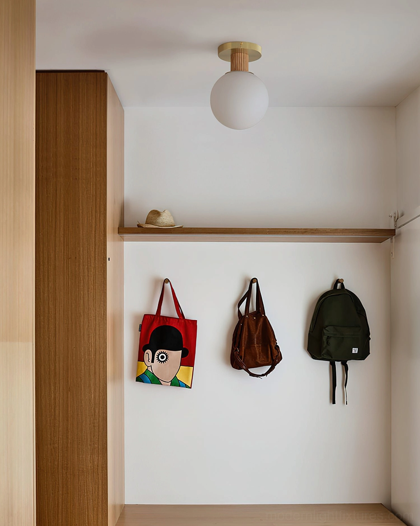 Neroma ceiling light fixture overhead view in minimalist entryway closet space with warm glow